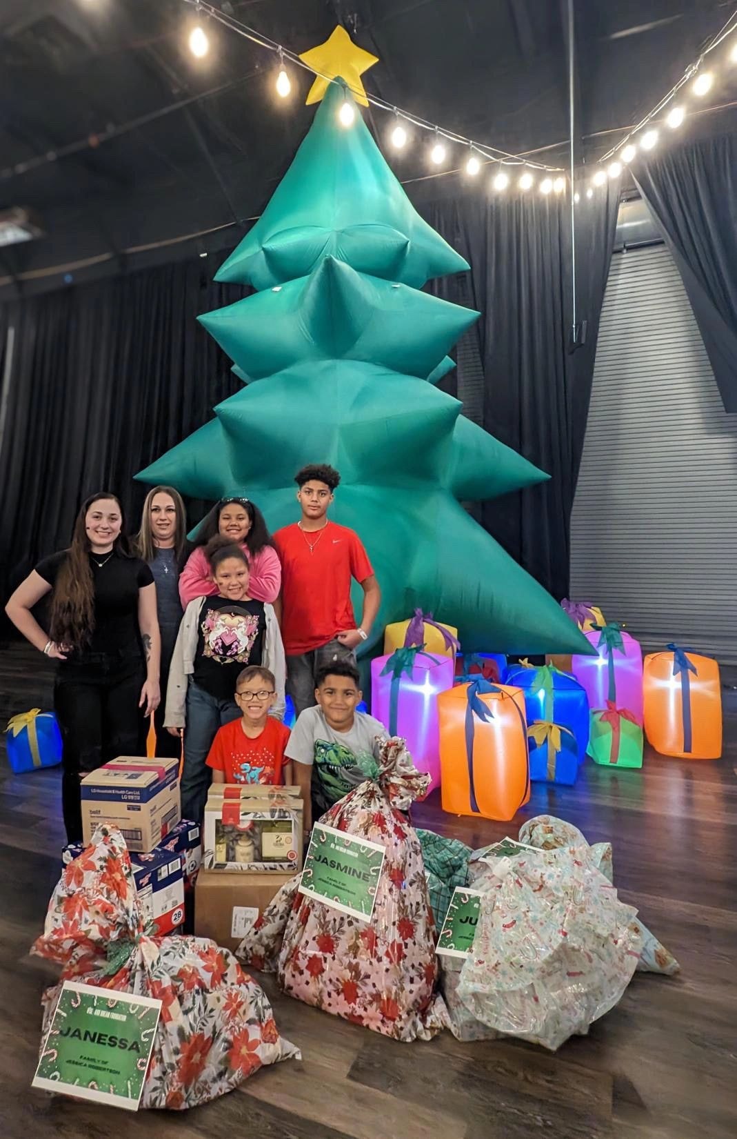 RISE Holiday Giving event with children and families
